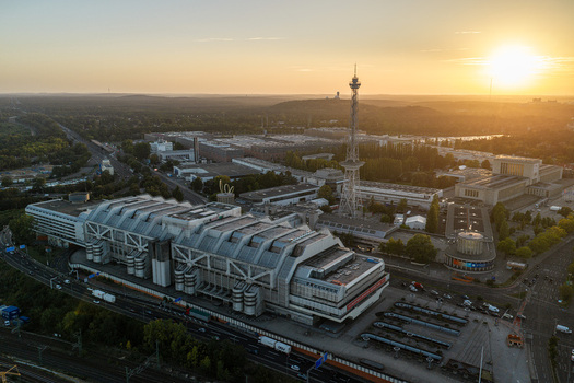 Aerial view of the Internationales Congress Centrum a prominent example of Brutalist architecture surrounded by urban infrastructure and greenery in Berlin Berlin Germany. Aerial view of the Internationales Congress Centrum a prominent example of Brutalist architecture surrounded by urban infrastructure and greenery in Berlin Berlin Germany.