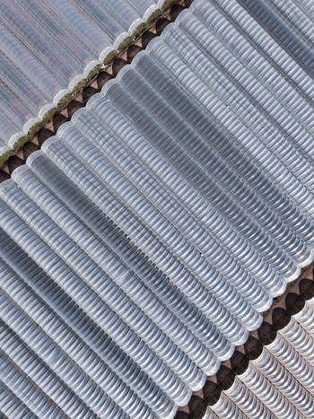 Aerial view of a corrugated metal surface with repetitive patterns reflecting light and shadow creating a textured abstract Stafford England United Kingdom. Aerial view of a corrugated metal surface with repetitive patterns reflecting light and shadow creating a textured abstract Stafford England United Kingdom.