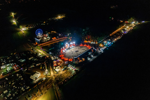 Herzogenaurach Germany 27 July 2025 Aerial view of the Open Beatz Festival at night with illuminated stages a ferris wheel and crowds of people under the dark sky. Herzogenaurach Germany 27 July 2025 Aerial view of the Open Beatz Festival at night with illuminated stages a ferris wheel and crowds of people under the dark sky.