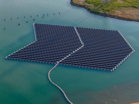 Aerial view of floating solar panel array on a lake in Bensheim Hessen Germany. Aerial view of floating solar panel array on a lake in Bensheim Hessen Germany.