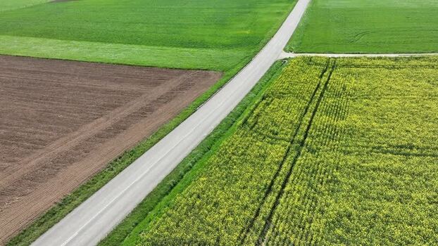 Aerial view of agricultural fields and road France.