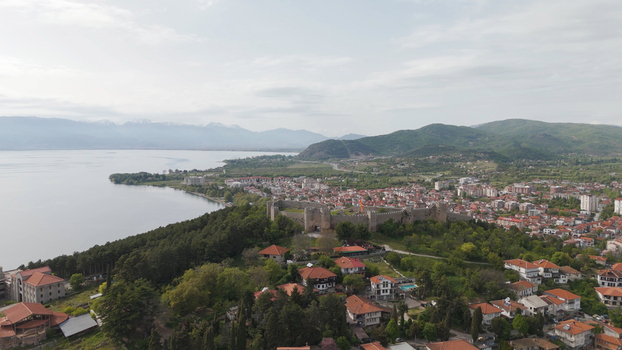 Aerial view of Samuel s Fortress overlooking the historic town of Ohrid and Lake Ohrid with red tiled rooftops green hills and distant mountains Ohrid Municipality of Ohrid North Macedonia. Aerial view of Samuel s Fortress overlooking the historic town of Ohrid and Lake Ohrid with red tiled rooftops green hills and distant mountains Ohrid Municipality of Ohrid North Macedonia.