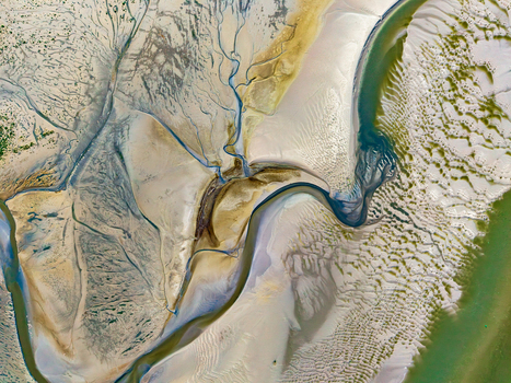 Aerial view of Baie de Somme showing intricate tidal channels sandbanks and patterns in the mudflats in Saint Valery sur Somme Hauts de France France. Aerial view of Baie de Somme showing intricate tidal channels sandbanks and patterns in the mudflats in Saint Valery sur Somme Hauts de France France.