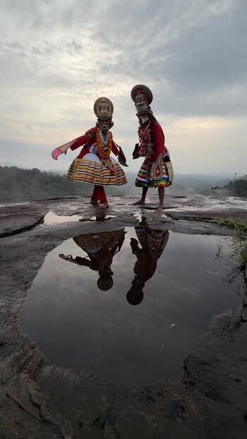 View of Kathakali dancers performing on a rocky hill in Kochi India. View of Kathakali dancers performing on a rocky hill in Kochi India.