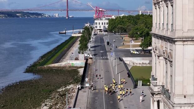 Aerial view of runners near Praca do Comercio Portugal.