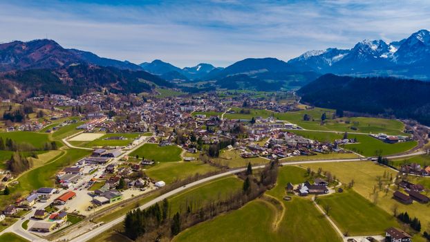 Aerial view of the valley town nestled amid rolling green hills and majestic mountains a serene blend of nature and architecture Windischgarsten Upper Austria Austria. Aerial view of the valley town nestled amid rolling green hills and majestic mountains a serene blend of nature and architecture Windischgarsten Upper Austria Austria.