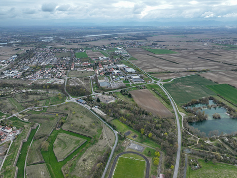 Aerial view of the star shaped fortress with its intricate bastions contrasting with the sprawling fields Neuf Brisach Grand Est France.