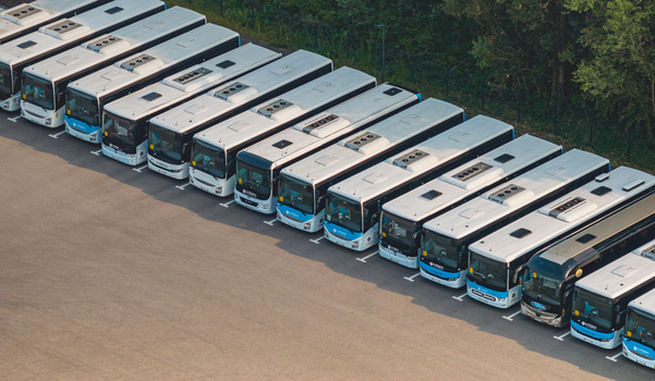 Loriol sur Drome France 26 July 2026 Aerial view of a fleet of modern public transport buses parked in parallel at a bus depot showcasing urban mobility and transit infrastructure.