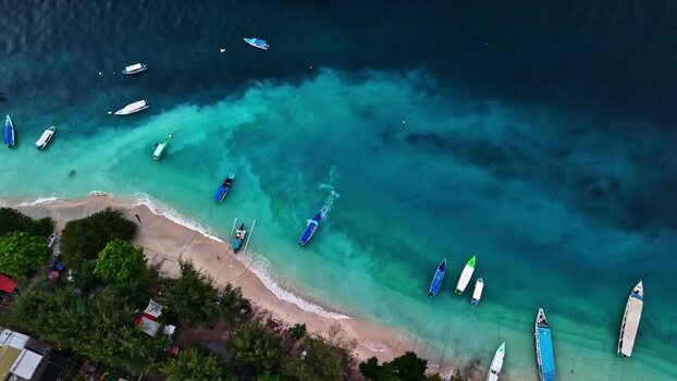 Aerial view of boats on a beach in Bali Indonesia.