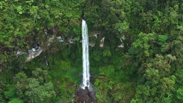 Aerial view of Waterfall Kayu Aro in the rainforest Indonesia. Aerial view of Waterfall Kayu Aro in the rainforest Indonesia.