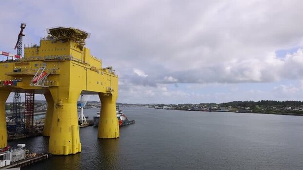 Aerial view of a yellow offshore platform in the harbor Norway.