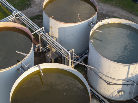 Aerial view of industrial storage tanks at the Wieliczka Salt Mine with large cylindrical containers and metal piping systems in Wieliczka Lesser Poland Voivode Poland.