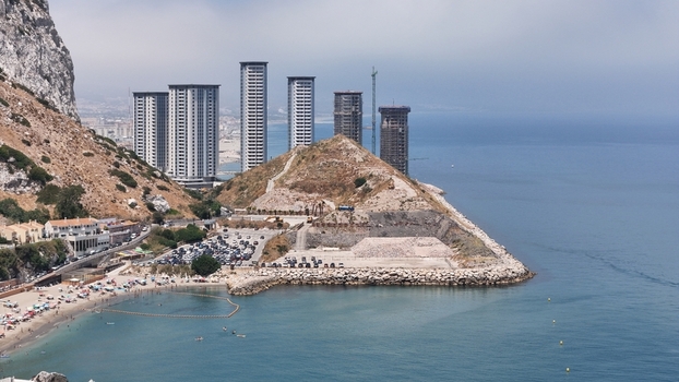 Gibraltar Gibraltar 02 July 2024 Aerial view of the Eastside Project construction site with high rise towers rocky coastal terrain and a beach by the Mediterranean Sea. Gibraltar Gibraltar 02 July 2024 Aerial view of the Eastside Project construction site with high rise towers rocky coastal terrain and a beach by the Mediterranean Sea.