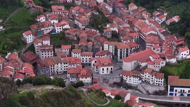 Aerial view of the colorful houses and red rooftops of Cudillero Spain. Aerial view of the colorful houses and red rooftops of Cudillero Spain.