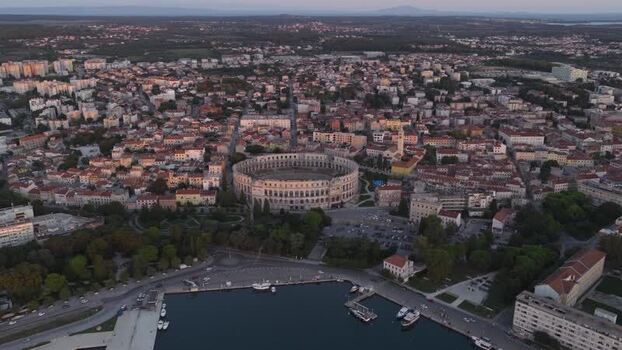 Aerial view of Pula Arena and city harbor in Croatia. Aerial view of Pula Arena and city harbor in Croatia.