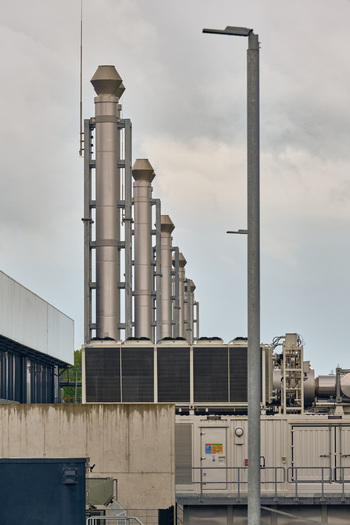 Middenmeer Netherlands 17 May 2026 View of Microsoft datacenters on Agriport along the A7 with industrial exhaust stacks and cooling infrastructure under a cloudy sky.