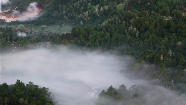 Aerial view of Dieng Plateau with thick mist and forest Indonesia. Aerial view of Dieng Plateau with thick mist and forest Indonesia.