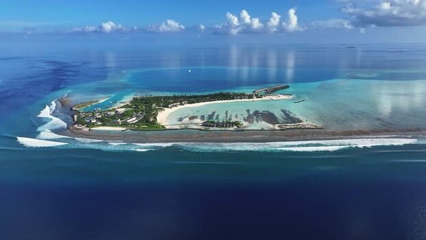 Aerial view of tropical resort with turquoise lagoon and beach Maldives. Aerial view of tropical resort with turquoise lagoon and beach Maldives.