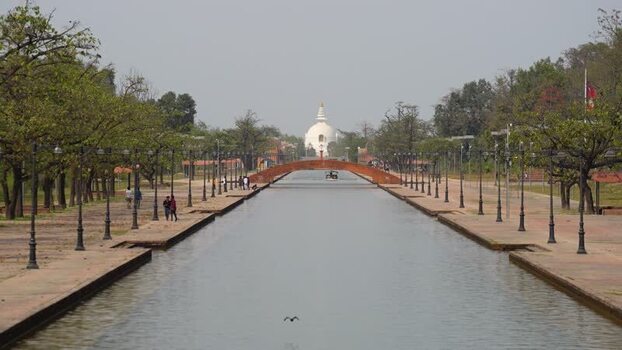 View of the World Peace Pagoda and central canal in Lumbini Nepal.