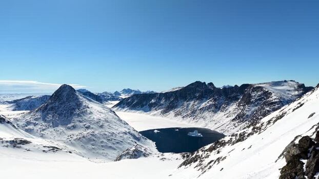 Aerial view of snowy mountains and a fjord Greenland. Aerial view of snowy mountains and a fjord Greenland.