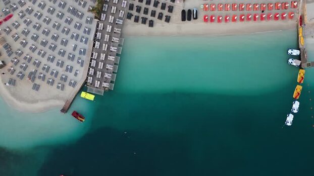 Aerial view of beach with sun loungers in Ksamil Albania.