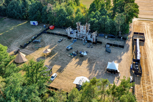 Herzogenaurach Germany 22 July 2022 Aerial view of the Open Beatz Festival stage setup under construction surrounded by lush green trees and fields. Herzogenaurach Germany 22 July 2022 Aerial view of the Open Beatz Festival stage setup under construction surrounded by lush green trees and fields.