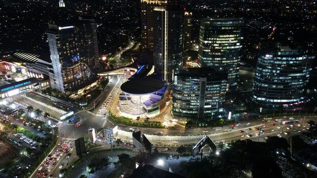 Kecamatan Kebayoran Lama Indonesia 22 September 2022 Aerial view of Pondok Indah Mall 2 at night with surrounding high rise buildings busy traffic and city lights. Kecamatan Kebayoran Lama Indonesia 22 September 2022 Aerial view of Pondok Indah Mall 2 at night with surrounding high rise buildings busy traffic and city lights.