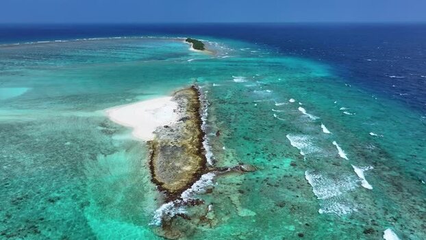 Aerial view of a tropical sandbank and coral reefs Maldives. Aerial view of a tropical sandbank and coral reefs Maldives.