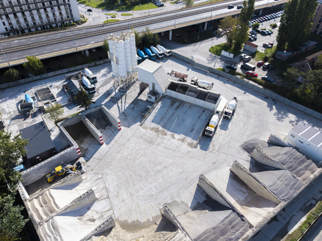 Aerial view of the Holcim concrete plant featuring mixing silos cement trucks and aggregate storage piles in an industrial area of Krakow Lesser Poland Voivode Poland.