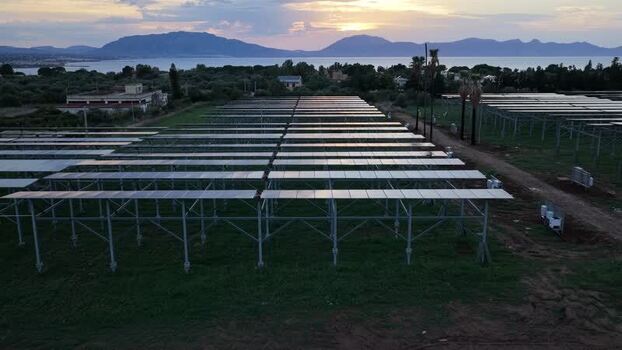Aerial view of solar farm at sunset in Terrasini Italy.