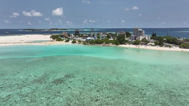Aerial view of the turquoise lagoon and beach of Gulhi Maldives. Aerial view of the turquoise lagoon and beach of Gulhi Maldives.