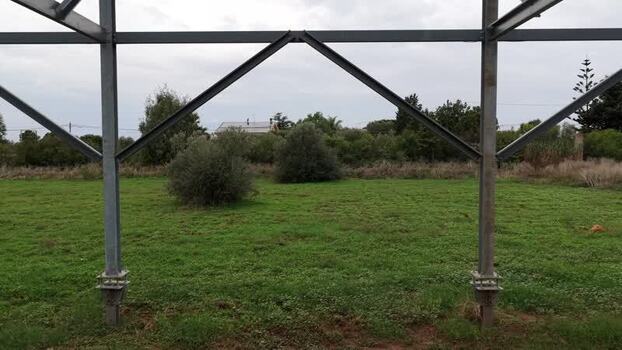Aerial view of metal structure in a field Italy.