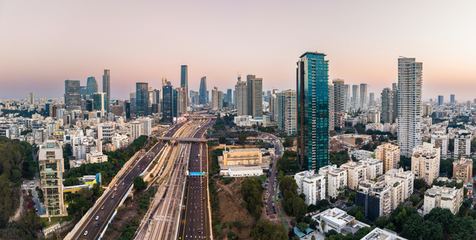 Aerial view of the Tel Aviv Yafo skyline at sunset featuring modern skyscrapers the Ayalon Highway with traffic and urban architecture in Tel Aviv Yafo Tel Aviv District Israel. Aerial view of the Tel Aviv Yafo skyline at sunset featuring modern skyscrapers the Ayalon Highway with traffic and urban architecture in Tel Aviv Yafo Tel Aviv District Israel.