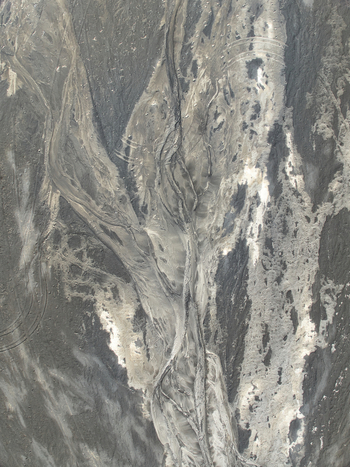 Aerial view of the volcanic landscape near Maelifell featuring dark volcanic sand intricate glacial river patterns and textured terrain in Kirkjubaejarklaustur Skaftarhreppur Iceland. Aerial view of the volcanic landscape near Maelifell featuring dark volcanic sand intricate glacial river patterns and textured terrain in Kirkjubaejarklaustur Skaftarhreppur Iceland.
