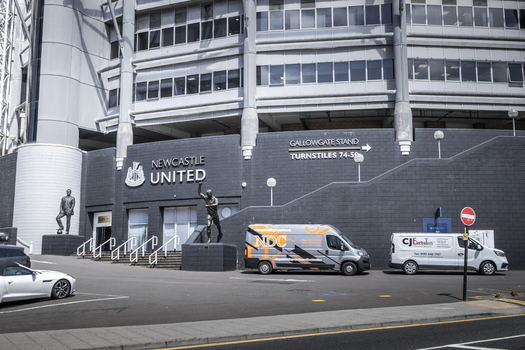 Newcastle upon Tyne United Kingdom 13 July 2026 View of the Gallowgate Stand entrance at St. James Park stadium featuring the Newcastle United crest statues and service vans. Newcastle upon Tyne United Kingdom 13 July 2026 View of the Gallowgate Stand entrance at St. James Park stadium featuring the Newcastle United crest statues and service vans.