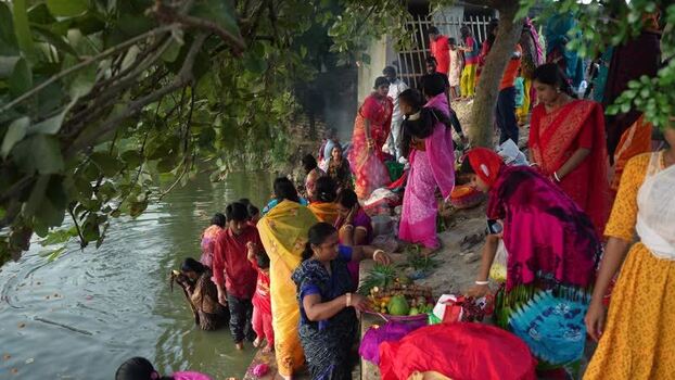 View of people performing religious rituals by a river Bangladesh. View of people performing religious rituals by a river Bangladesh.