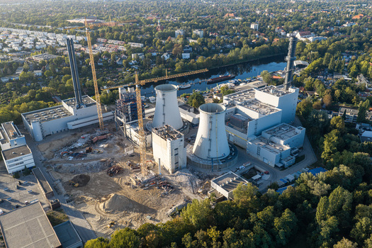 Aerial view of the Combined Heat and Power Plant Lichterfelde during deconstruction with cooling towers cranes and industrial structures near a river in Berlin Berlin Germany. Aerial view of the Combined Heat and Power Plant Lichterfelde during deconstruction with cooling towers cranes and industrial structures near a river in Berlin Berlin Germany.