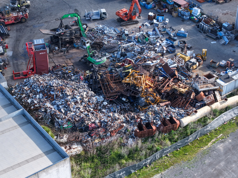 Melbourne Australia 22 September 2026 Aerial view of the scrap metal recycling yard in Kilsyth with piles of metal waste heavy machinery excavators and industrial containers. Melbourne Australia 22 September 2026 Aerial view of the scrap metal recycling yard in Kilsyth with piles of metal waste heavy machinery excavators and industrial containers.