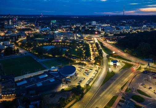 Aerial view of Vilnius at night featuring illuminated roads modern office buildings a park with a pond and the distant skyline in Vilnius Vilnius County Lithuania. Aerial view of Vilnius at night featuring illuminated roads modern office buildings a park with a pond and the distant skyline in Vilnius Vilnius County Lithuania.