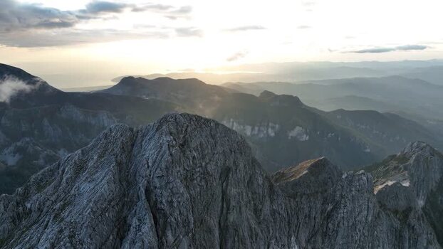 Aerial view of Pizzo d Uccello mountain peak at sunset Italy.