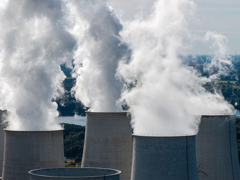 Aerial view of the Janschwalde Power Station cooling towers emitting steam showcasing the industrial landscape near Peitz Brandenburg Germany. Aerial view of the Janschwalde Power Station cooling towers emitting steam showcasing the industrial landscape near Peitz Brandenburg Germany.