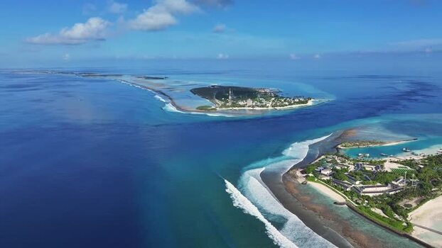 Aerial view of tropical islands and turquoise ocean waters Maldives. Aerial view of tropical islands and turquoise ocean waters Maldives.