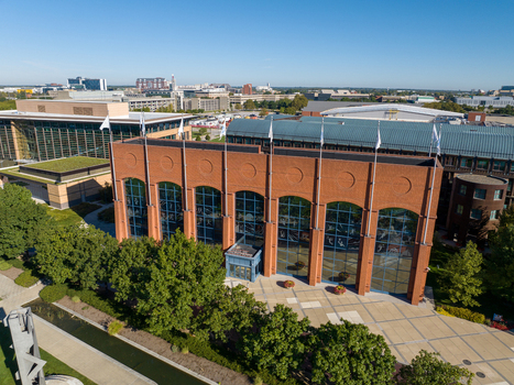 Indianapolis United States 27 September 2026 Aerial view of the NCAA Hall of Champions featuring its distinctive brick facade large glass windows and surrounding park landscape. Indianapolis United States 27 September 2026 Aerial view of the NCAA Hall of Champions featuring its distinctive brick facade large glass windows and surrounding park landscape.