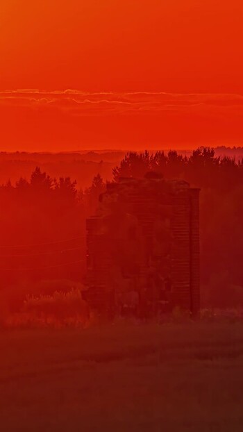View of a silhouette of a historic tower at sunset Latvia. View of a silhouette of a historic tower at sunset Latvia.
