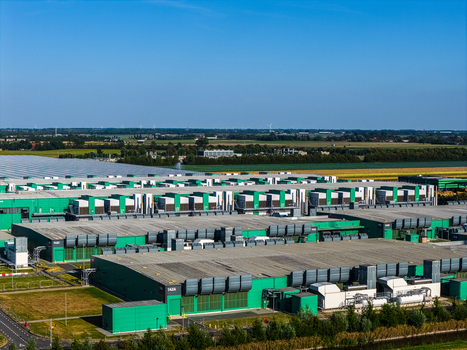 Aerial view of Agriport A7 a large industrial greenhouse complex with green and grey roofs and ventilation units surrounded by agricultural fields in Middenmeer Noord Holland Netherlands. Aerial view of Agriport A7 a large industrial greenhouse complex with green and grey roofs and ventilation units surrounded by agricultural fields in Middenmeer Noord Holland Netherlands.