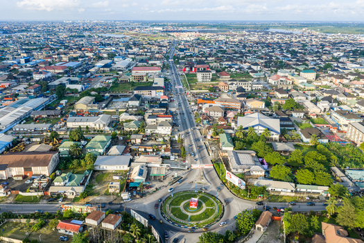 Port Harcourt Nigeria 03 July 2026 Aerial view of the cityscape featuring a prominent roundabout dense urban development residential buildings and lush greenery under a clear sky. Port Harcourt Nigeria 03 July 2026 Aerial view of the cityscape featuring a prominent roundabout dense urban development residential buildings and lush greenery under a clear sky.