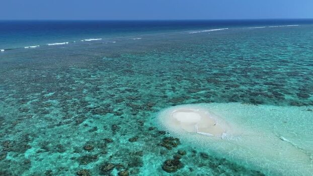 Aerial view of a sandbank and coral reefs in the ocean Maldives. Aerial view of a sandbank and coral reefs in the ocean Maldives.