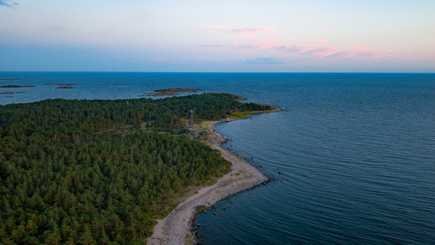 Aerial view of Oro Fortress Island surrounded by dense pine forests and rocky coastlines along the Baltic Sea in Oro Varsinais Suomi Finland. Aerial view of Oro Fortress Island surrounded by dense pine forests and rocky coastlines along the Baltic Sea in Oro Varsinais Suomi Finland.