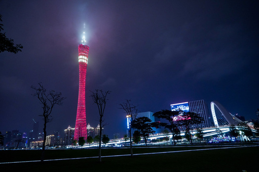 Guangzhou Guangdong Province China 24 February 2024 View of the illuminated Canton Tower rising above the modern city skyline at night. Guangzhou Guangdong Province China 24 February 2024 View of the illuminated Canton Tower rising above the modern city skyline at night.
