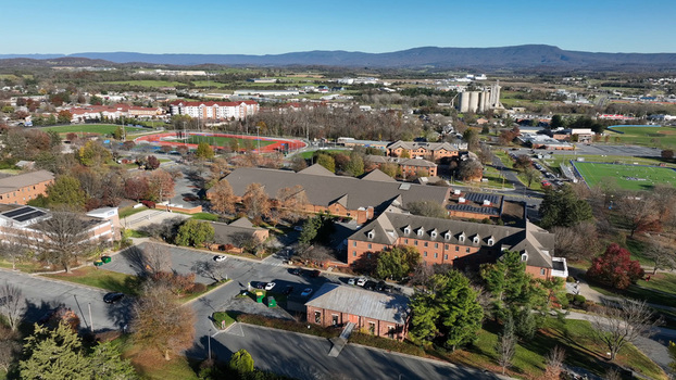 Aerial view of the campus buildings parking lots and athletic fields in Harrisonburg Virginia United States. Aerial view of the campus buildings parking lots and athletic fields in Harrisonburg Virginia United States.